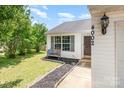 Charming home exterior with well-manicured lawn, featuring a bench and lovely landscaping at 4002 Solomons Ct, Monroe, NC 28110