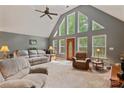 Bright living room with a vaulted ceiling and large windows at 4038 Forest Brook Dr, Edgemoor, SC 29712