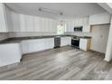Beautiful kitchen with white cabinets, stainless steel appliances, and updated flooring at 409 S Martin Luther King Jr Ave, Salisbury, NC 28144