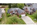 Beautiful home featuring a landscaped yard, patio, and two car garage at 5706 Sustar Dr, Monroe, NC 28110