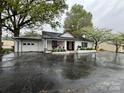 Charming home features a covered porch, attached garage, and landscaping at 713 Sloop Ave, Kannapolis, NC 28083