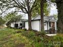 Exterior view features a well-manicured lawn and an attached garage at 713 Sloop Ave, Kannapolis, NC 28083