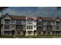 Exterior view of newly constructed townhomes with brick and siding, showcasing the architectural style and design at 743 Hoke Ln, Davidson, NC 28036