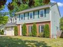 Attractive two-story home with brick accents, green shutters, and a meticulously maintained front yard at 9430 Peckham Rye Rd, Mint Hill, NC 28227