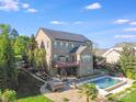 Beautiful backyard featuring a patio, pool, hot tub, and landscaped yard at 9433 Stonebridge Way, Mint Hill, NC 28227