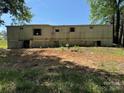 Rear view of the manufactured home, showing a crawl space under the house at 1029 Sullivan St, Wadesboro, NC 28170