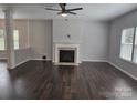 Spacious living room featuring hardwood floors and a fireplace at 1071 Bassett Way, Fort Mill, SC 29707