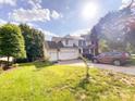 Home exterior shows a well-kept lawn, long driveway, attached two-car garage, and a basketball hoop at 10804 Back Ridge Rd, Charlotte, NC 28277