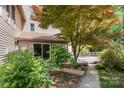 Backyard view showing mature trees, deck, patio furniture and attractive landscaping at 1160 Walton Pl, Salisbury, NC 28146