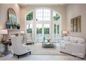 Bright living room boasts large windows, fireplace, and neutral decor with plenty of space at 140 Lightship Dr, Mooresville, NC 28117