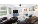 Cozy living room with neutral walls, hardwood floors, and ample natural light from large windows at 192 Bailey Ave, Rock Hill, SC 29732