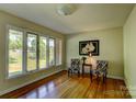 Bright living room with hardwood floors, large windows, and elegant decor at 211 Amos Homesley Rd, Cherryville, NC 28021