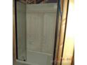 Bathroom with a new shower unit at 216 N Rowan Ave, Spencer, NC 28159