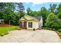 Charming home with a spacious driveway surrounded by mature trees and greenery at 2745 Stockwood Dr, Gastonia, NC 28056