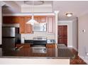 Kitchen boasts granite counters, stainless steel appliances and nearby hardwood entry at 300 W 5Th St # 404, Charlotte, NC 28202