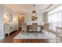 Formal dining room featuring stylish chandelier, neutral colors, and large windows at 3304 Danhill Pl, Matthews, NC 28105