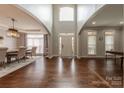 Elegant foyer with soaring ceilings, hardwood floors, and an inviting front entrance at 3304 Danhill Pl, Matthews, NC 28105