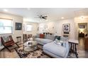 Comfortable living room with neutral walls, ceiling fan, and stylish decor with a modern sofa at 3307 Draper Ave, Charlotte, NC 28205
