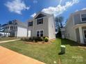 Charming home surrounded by green lawn and other new constructions in a sunny neighborhood at 4017 Grommet Ct, Matthews, NC 28105