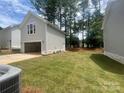 Detached garage with ample backyard space and lush green grass at 4017 Grommet Ct, Matthews, NC 28105