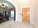Welcoming foyer with a wooden door and tiled flooring, offering a glimpse into the office space at 4562 Lanstone Sw Ct, Concord, NC 28027