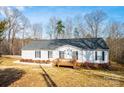 Inviting one-story home with a covered porch, black shutters, and a well-maintained lawn, perfect for suburban living at 4845 Midway Sand Rd, Hickory, NC 28601