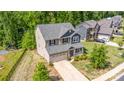 An aerial view of a well-maintained two-story home with lush lawn and mature trees on a sunny day at 5065 Watersail Way, Clover, SC 29710
