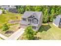 Charming two-story home with a well-maintained lawn and an attached two-car garage in a suburban setting at 5065 Watersail Way, Clover, SC 29710