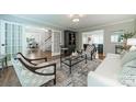 Comfortable living room with hardwood floors, neutral walls, and access to the dining room at 5135 Winding Brook Rd, Charlotte, NC 28226