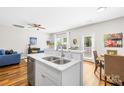 Open-concept kitchen with stainless steel appliances, granite countertops, and a seamless transition to the living area at 5648 Woodard St, Charlotte, NC 28269