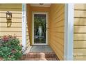 Inviting front porch with a glass door and brick steps, enhancing curb appeal at 11701 Brockley Ct, Charlotte, NC 28215