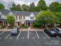 Aerial shot of townhouses with ample parking; well-maintained landscaping and mature trees surround the properties at 118 Barnhardt Loop, Mooresville, NC 28117
