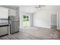 Open living area featuring large windows and a sliding door to the backyard at 1554 Doran Ter, Richburg, SC 29729