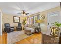 Inviting living room with hardwood floors, neutral tones, and comfortable seating, creating a cozy atmosphere at 1792 Hoffman Rd, Gastonia, NC 28054