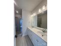 Bathroom featuring double vanity, quartz countertops, and glass shower door at 2013 Clarksdale Dr # 38, Charlotte, NC 28206