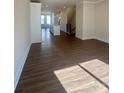 Spacious living room boasts natural light, hardwood floors, and open floor plan at 2013 Clarksdale Dr # 38, Charlotte, NC 28206