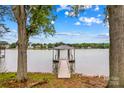 Private dock with a covered area, perfect for enjoying waterfront views at 242 Shoreline Loop, Mooresville, NC 28117