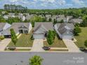 An aerial view of the neighborhood showcasing the house and surrounding greenery at 3043 Santee Ct, Fort Mill, SC 29707