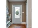 Inviting entryway featuring hardwood floors, decor and a decorative glass door at 308 Gillsbrook Rd, Lancaster, SC 29720
