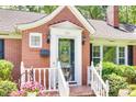 Close-up of the home's front door showing glass details and decorative lighting at 308 Gillsbrook Rd, Lancaster, SC 29720