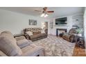 Cozy living room features a fireplace, hardwood floors, and neutral decor for relaxation at 308 Gillsbrook Rd, Lancaster, SC 29720