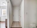 Bright entryway with neutral tones, tile flooring, and white doors and trim at 3109 Heathstead Pl, Charlotte, NC 28210