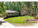 Two story home with lush landscaping and mature trees at 4700 Hickory Grove Rd, Mount Holly, NC 28120