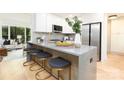 Modern kitchen featuring a breakfast bar with seating, stainless steel appliances at 6501 Piney Path Rd, Charlotte, NC 28212
