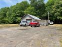 View of driveway with garage and multiple cars at 6504 Denver Heights Cir, Denver, NC 28037