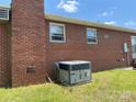 Brick home with a visible air conditioning unit near the wall at 675 E Ritchie Rd, Salisbury, NC 28146