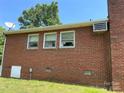Rear exterior of brick home, showcasing windows and roofline at 675 E Ritchie Rd, Salisbury, NC 28146