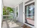 Relaxing front porch with rocking chairs, a view, and a welcome mat at 6909 Dunton St, Huntersville, NC 28078