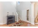 Inviting entryway featuring hardwood floors, a staircase, and decorative accents for a warm welcome at 815 Clearbrook Rd, Matthews, NC 28105