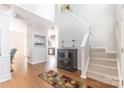 Bright entryway with high ceilings, hardwood floors, stairs and seamless transition to other rooms of the home at 815 Clearbrook Rd, Matthews, NC 28105